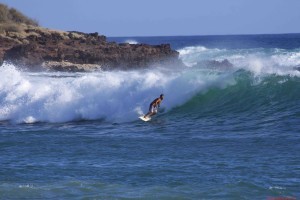 Surfing at Hulopoe Bay on Lanai Hawaii